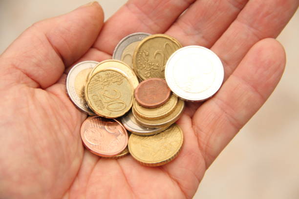 istock a handful of small money 1435343045
