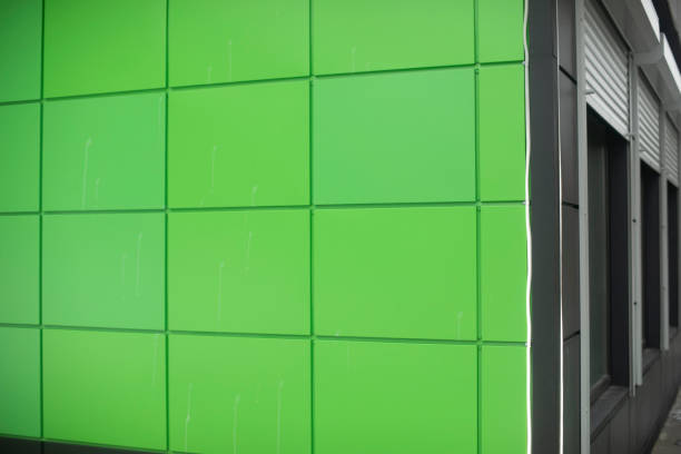 istock Green wall of panels. Details of building. Bright color in hybrid architecture. 1435347340