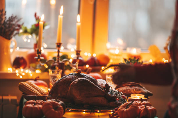 istock Thanksgiving holiday dinner table setting with fall decoration and pumpkins 1435348154