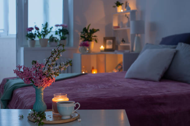 istock cozy bedroom in  evening with flowers and tea 1435351830