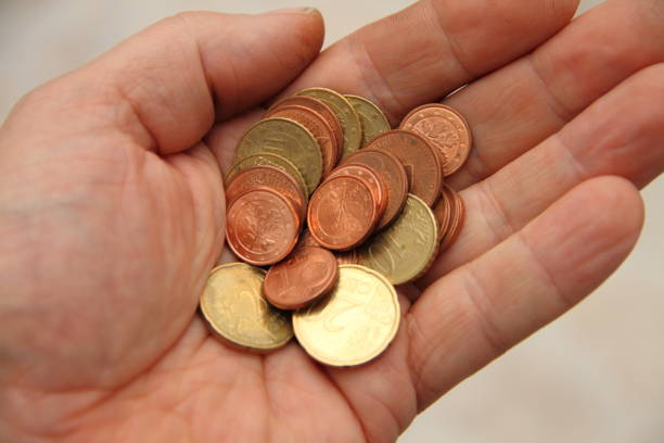 istock a handful of small money 1435352734