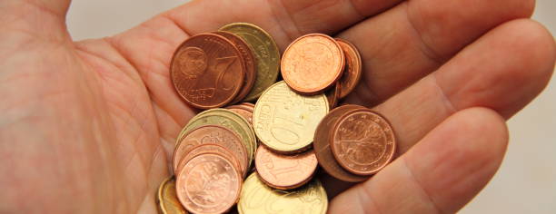 istock a handful of small money 1435352803