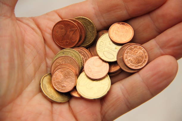 istock a handful of small money 1435352805