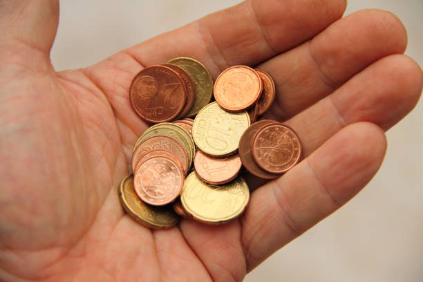 istock a handful of small money 1435352812