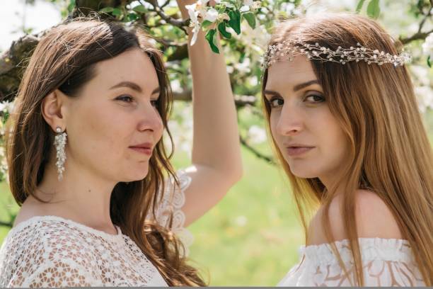 Beautiful women in the apple garden. High quality photo