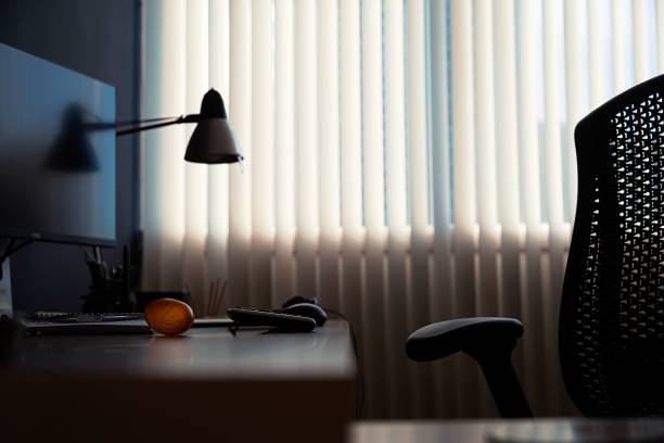 istock Home office with a computer on a desk and black chair 1435359204