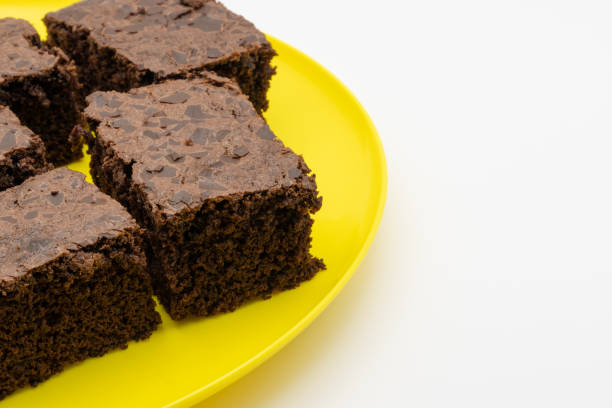 istock Some brownies on a yellow plate with white copy space 1435360438