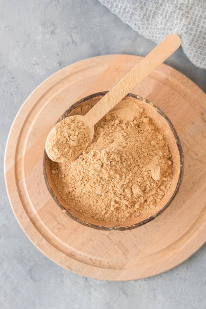 istock Top view of maca root powder on neutral grey background. Dietary supplement 1435362523