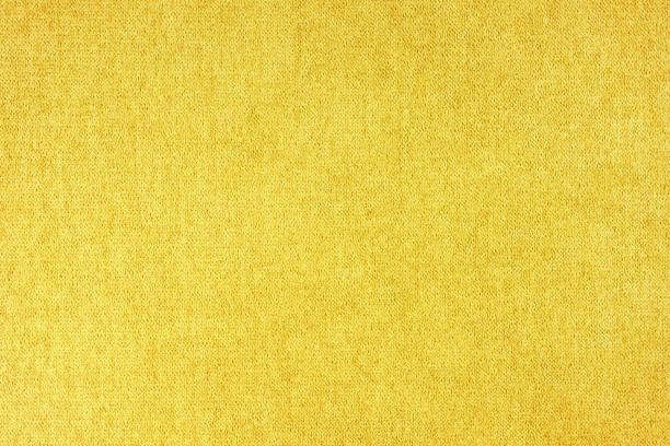 istock Yellow velours upholstery fabric texture background. 1435363118