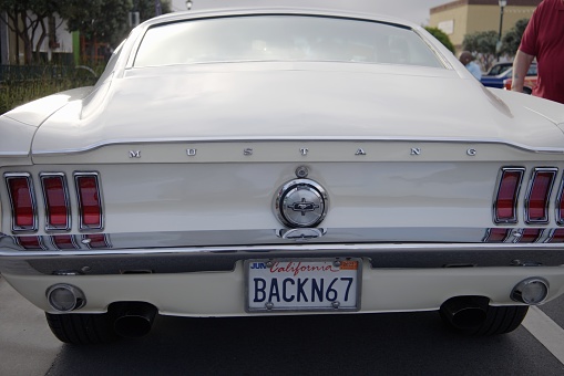 1967 Mustang with license plate saying back in 67