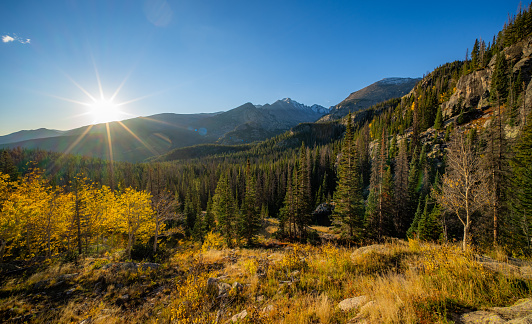 The sun rises over the landscape at Rocky Mountain National Park in Colorado