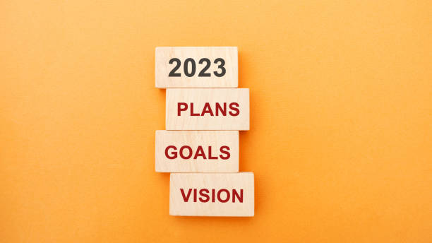 istock Wooden blocks with the word 2023, plans, goals, vision. Setting goal, target for next year. Plans and tasks. Financial management in company. Business and finance concept 1435373511