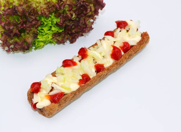 Fricandel, Frikadel speciaal, Dutch fast food snack on withe background fricandel, Dutch, frikadel, speciaal, unions, mayonaise, ketchup, close-up, white background frikandel speciaal stock pictures, royalty-free photos & images