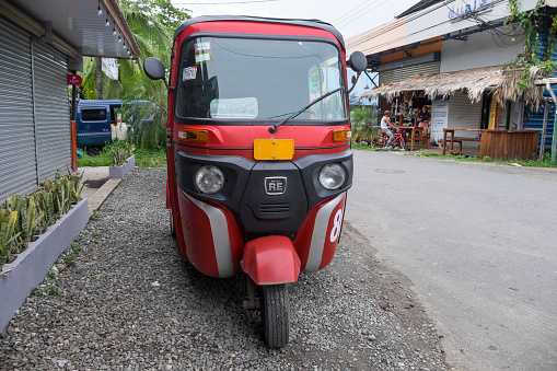 Limon, Costa Rica - September 14, 2022: Tuc Tuc parked on a street in the town of Puerto Viejo