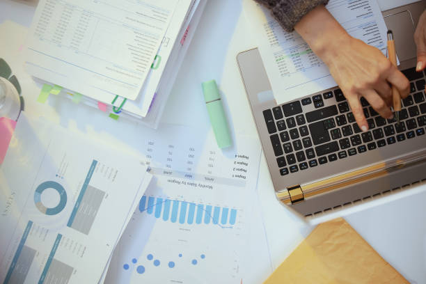 istock accountant woman with documents and laptop working 1435378921