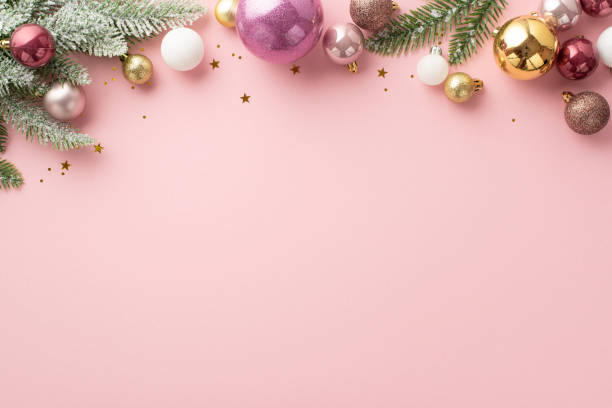 New Year concept. Top view photo of stylish white violet gold and pink baubles confetti and pine branches in snow on isolated light pink background with copyspace New Year concept. Top view photo of stylish white violet gold and pink baubles confetti and pine branches in snow on isolated light pink background with copyspace pink christmas tree stock pictures, royalty-free photos & images