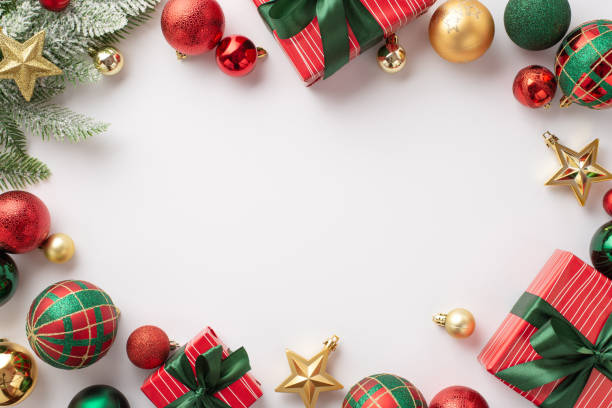 Christmas concept. Top view photo of red green and gold baubles star ornaments gift boxes with bows and pine branch on isolated white background with copyspace in the middle Christmas concept. Top view photo of red green and gold baubles star ornaments gift boxes with bows and pine branch on isolated white background with copyspace in the middle blank christmas card stock pictures, royalty-free photos & images