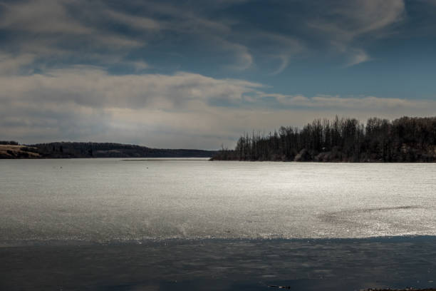 Thin layer of ice covering Pine Lake Pine Creek Alberta Canada