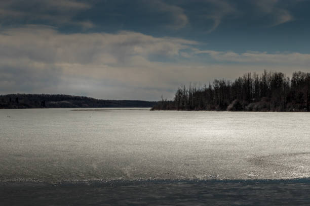 istock Thin layer of ice covering Pine Lake Pine Creek Alberta Canada 1435383182