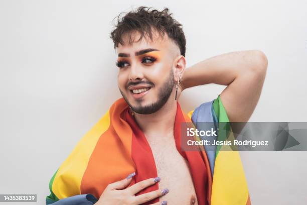 A Nonbinary Person Posing With An Lgbti Flag Stock Photo - Download Image Now - 20-29 Years, 25-29 Years, Adult