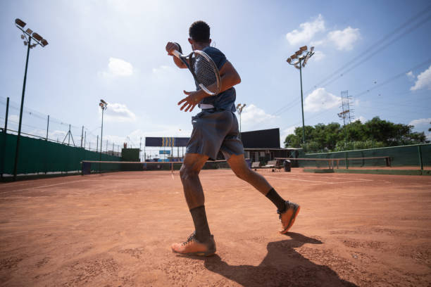 istock young man playing tennis 1435388106
