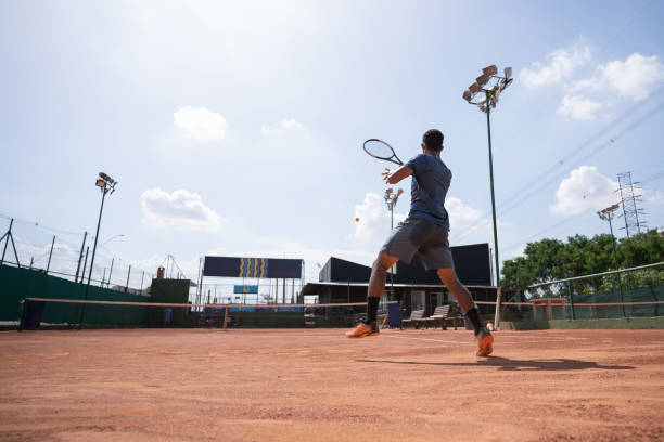 istock young man playing tennis 1435388126