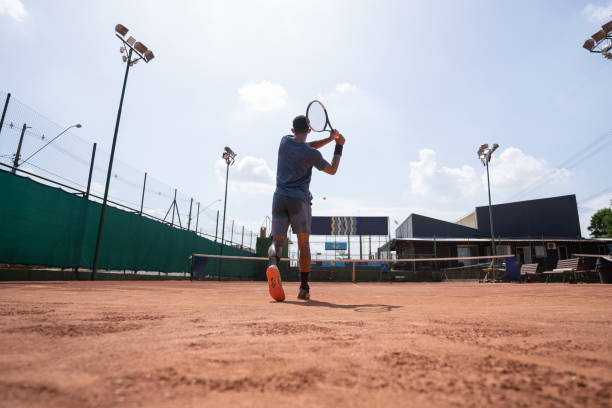 istock young man playing tennis 1435388128