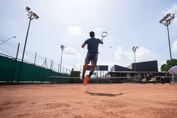 istock young man playing tennis 1435388151