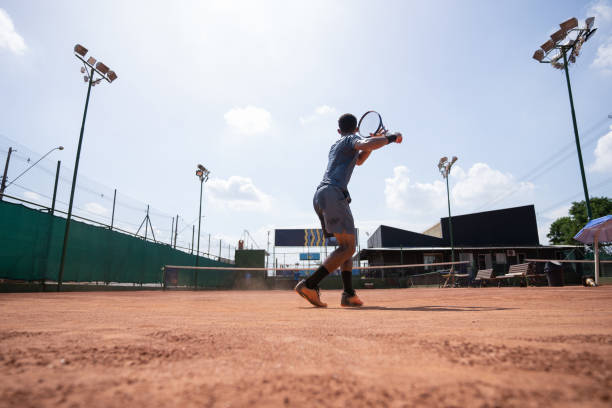 istock young man playing tennis 1435388202
