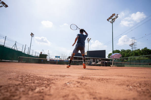 istock young man playing tennis 1435388234