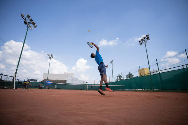 istock young man playing tennis 1435388260
