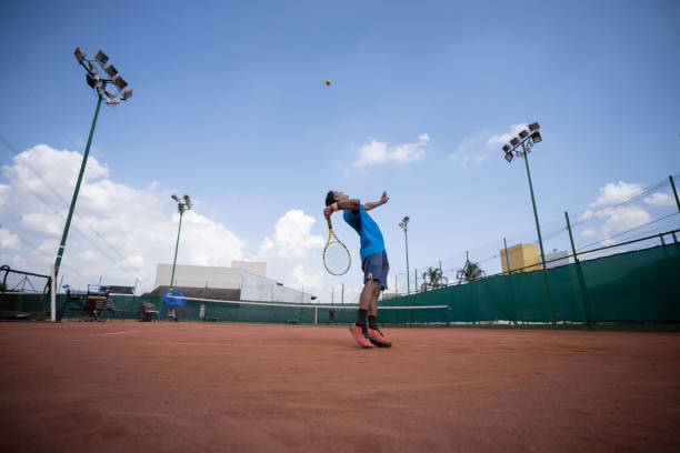istock young man playing tennis 1435388280