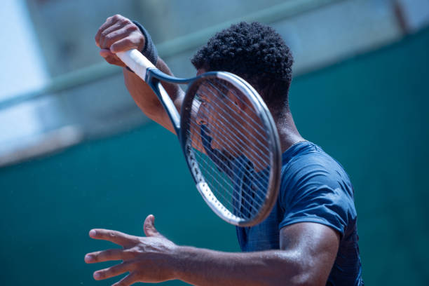 istock young man playing tennis 1435388293
