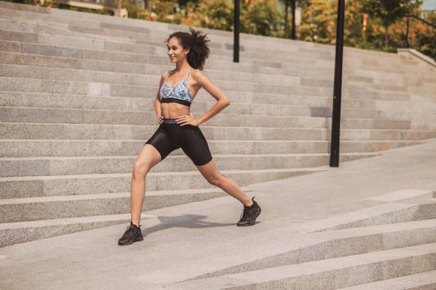 istock Cute girl exercising outside and looking involved 1435389945