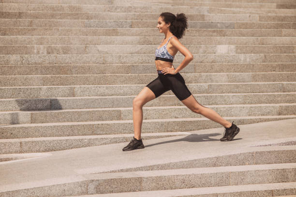istock Cute girl exercising outside and looking involved 1435389948