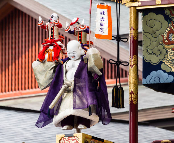 Wooden puppets on top of Hotei decorated float during annual Takayama Autumn Festival stock photo