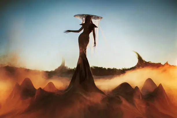 Asian gothic woman in hat against backdrop of smoke and blue sky. Fashion. Witch. Halloween look