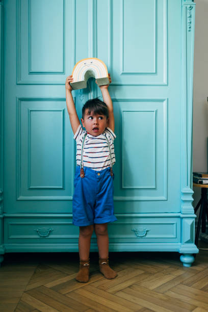 istock Little Boy Holding A Toy 1435390352