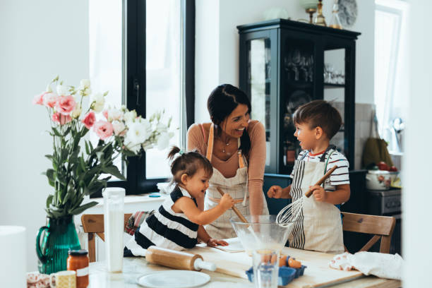 istock Family Making A Cake Together In The Kitchen 1435390447