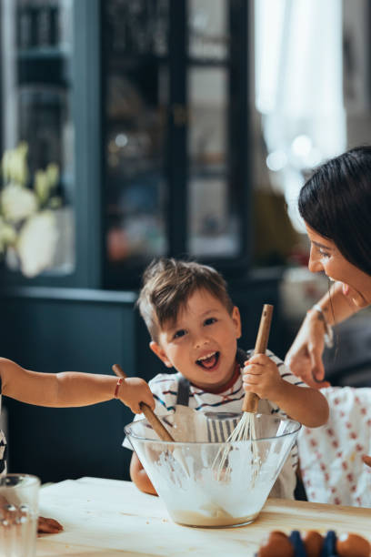 istock Little Boy Mixing Ingredients In The Bowl 1435390524