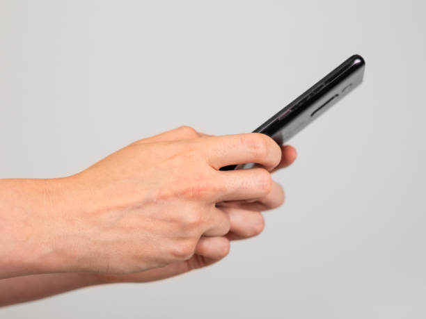 istock Woman hands closeup texting message at phone. Female using for instant messaging, sharing photos, videos in messengers or typing SMS. Online communication concept 1435390739