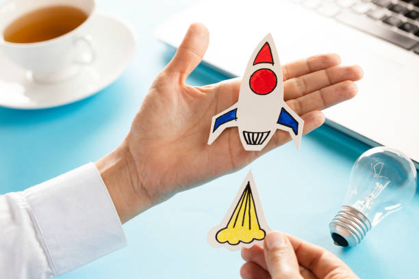 istock Business Person with Startup Rocket 1435393347