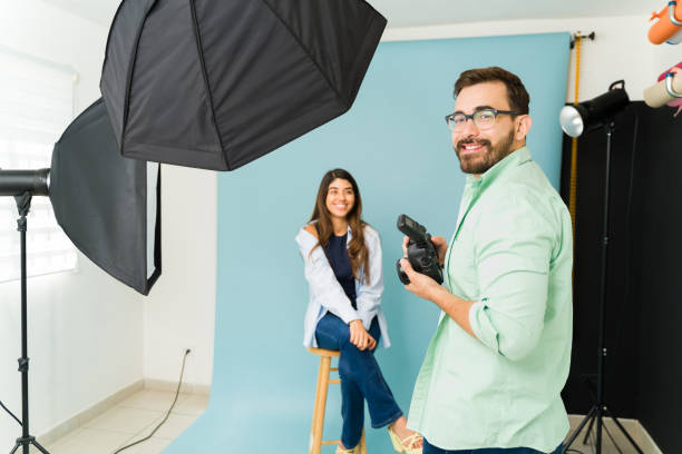 istock Smiling photographer and model at the photography studio 1435393356