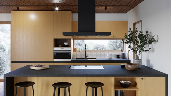 A modern kitchen with white walls and cabinets, featuring stainless steel appliances