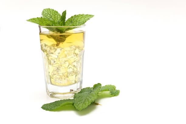 Mint tea in a glass isolated on a white background.