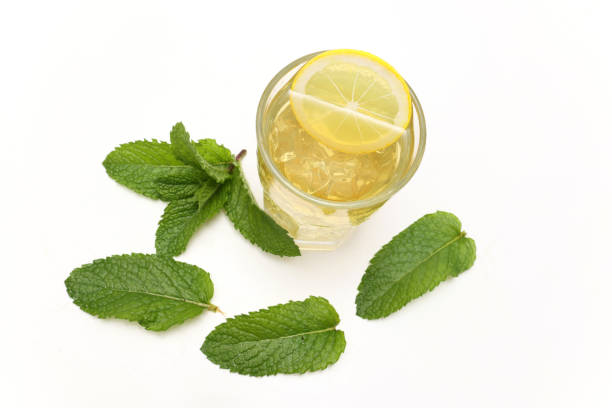 Mint tea in a glass isolated on a white background.