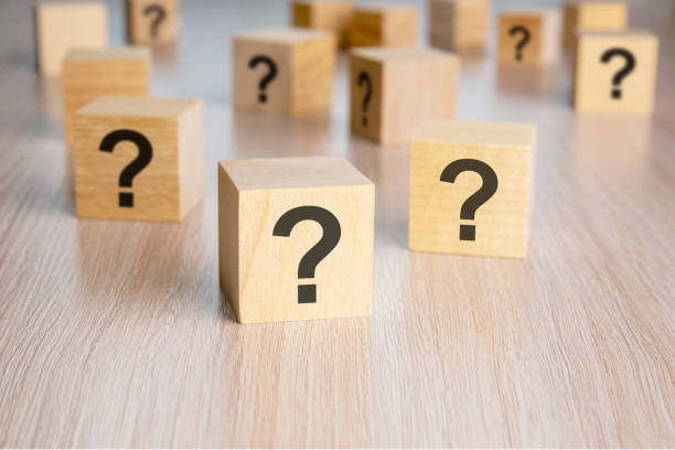 istock front view on many wood cubes with question marks. many question arising concept 1435401432