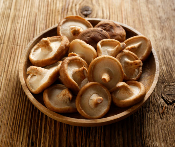 istock Fresh shitake mushrooms on a wooden plate 1435404300