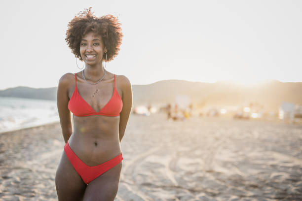 istock Cheerful black woman on summer vacation 1435405750