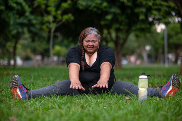 istock Mature Latin woman doing exercise at the park 1435407530